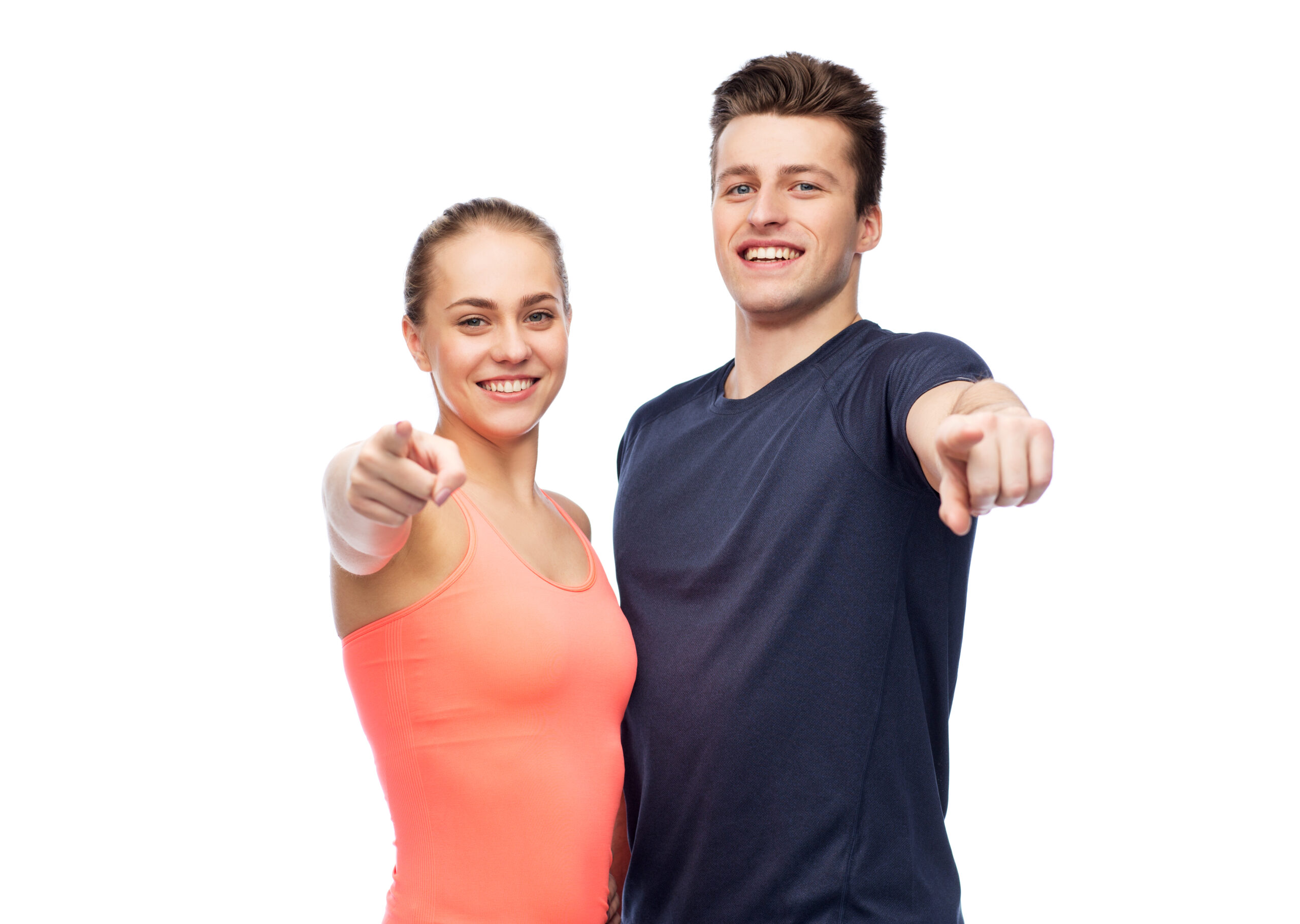 sport, fitness, lifestyle and people concept - happy sportive man and woman pointing finger on you